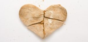 A heart shaped cookie that is broken up