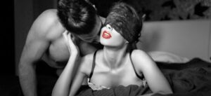 A male client kissing a masseuses cheek