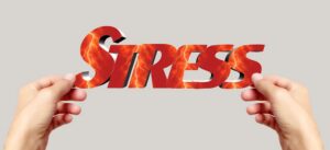 A person holding the word stress
