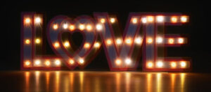 The word love lit up in lights